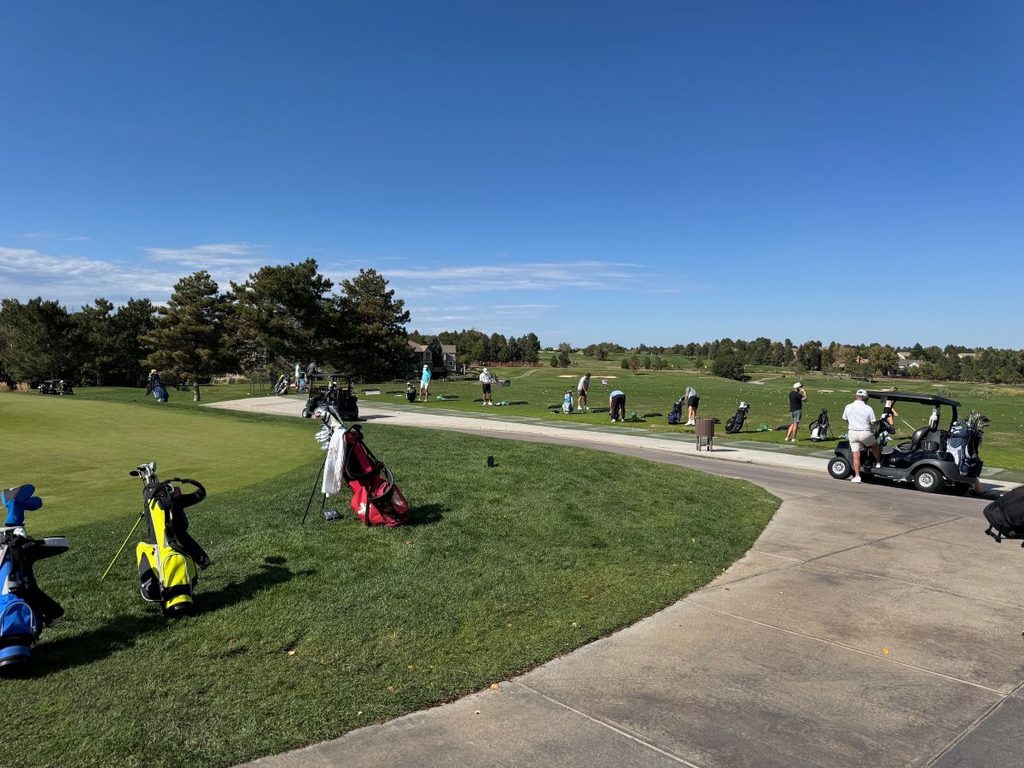 Golfers practicing at a Colorado Front Range golf course.