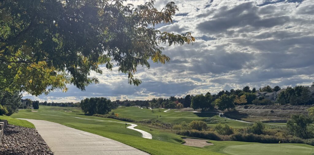 Walking path through a residential community beside a golf course