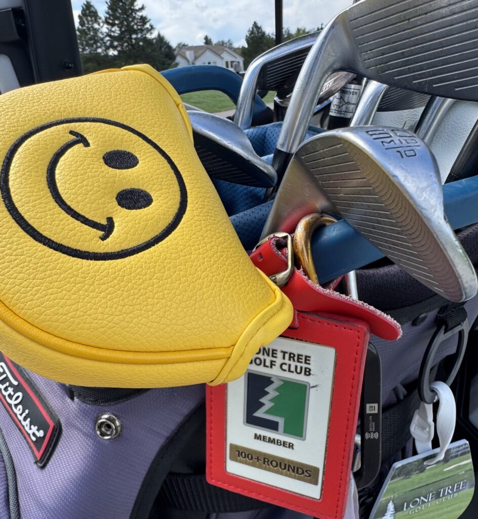 Golf bag with 100+ rounds golf tag.