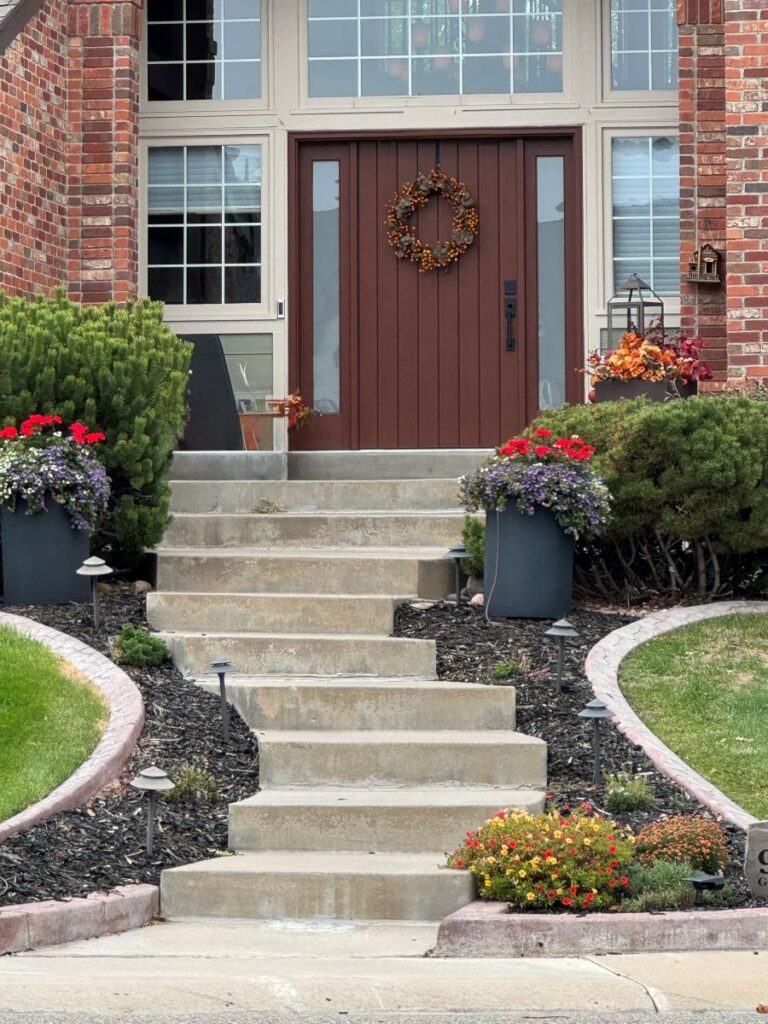 House with many steps up to front door.